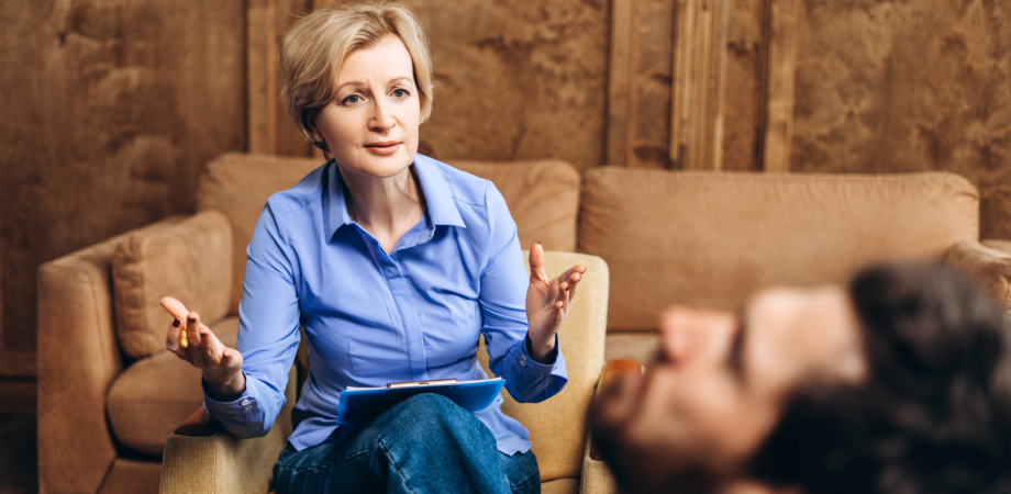 a woman talking to a man