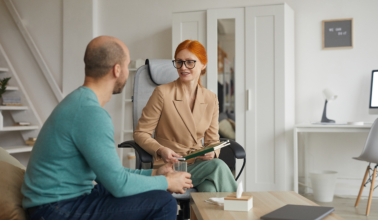 a woman talking to a man
