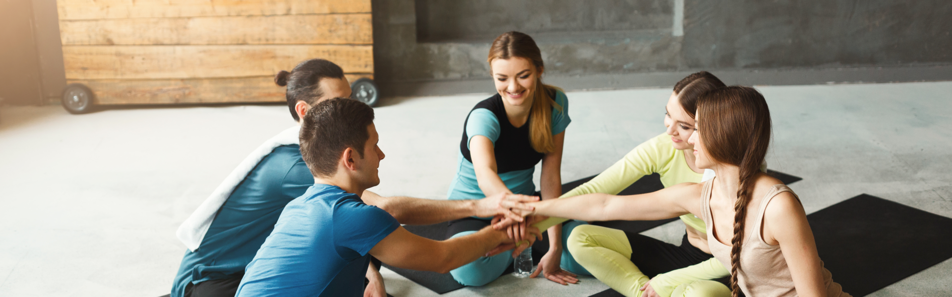 group of people with hands on the center